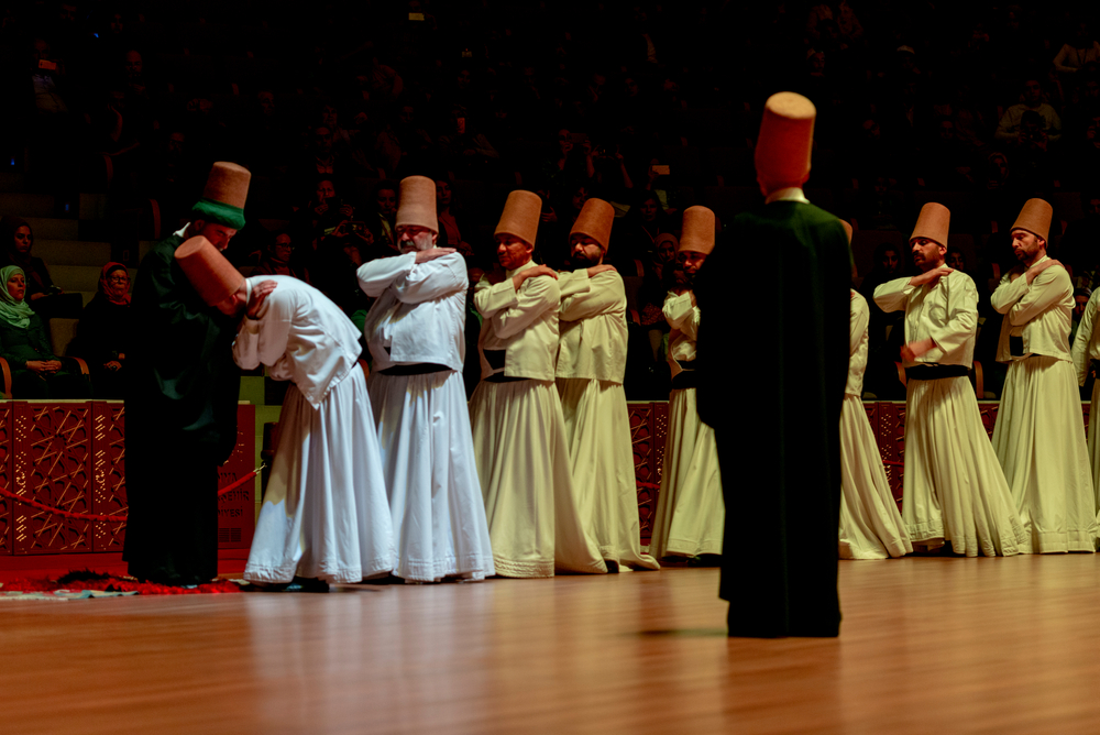 Whirling Dervishes bowing before the Sheikh during the ceremony