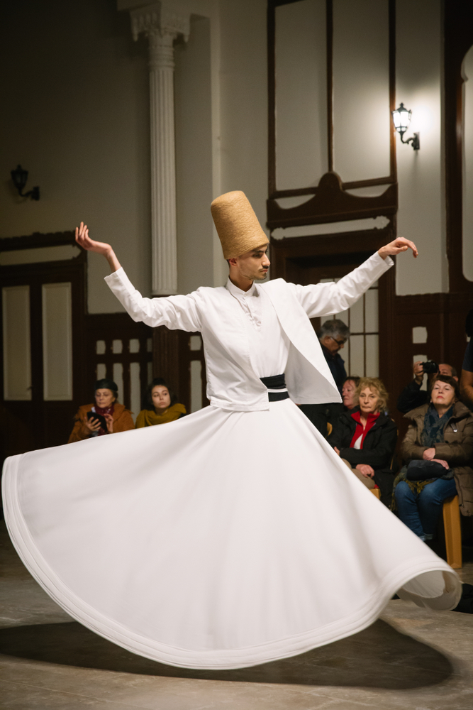 Traditional Whirling Dervish costume with sikke and white tennure